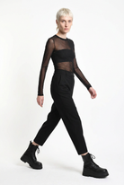 LA HAINE INSIDE US black carrot-fit trousers, walking side-front view