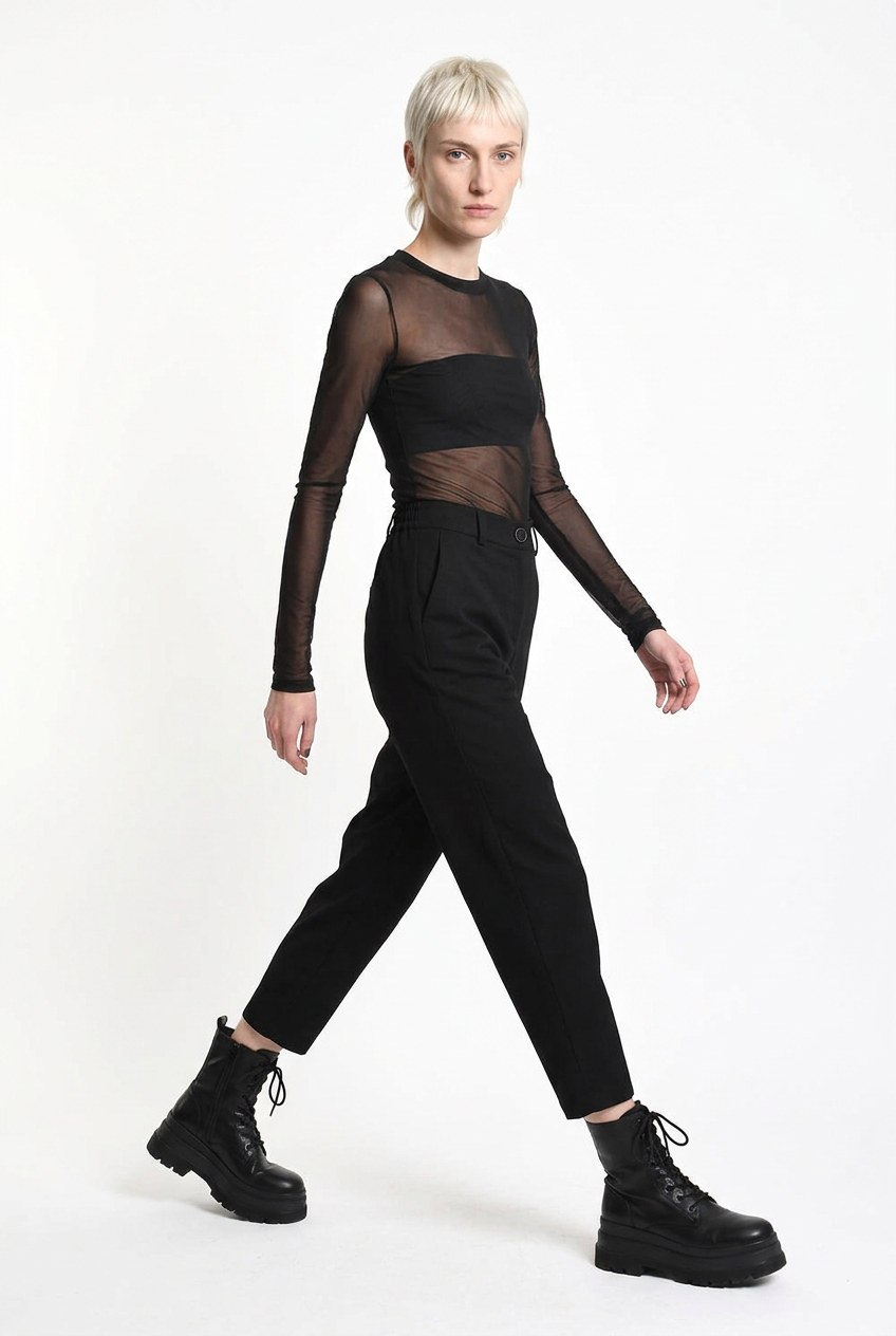 LA HAINE INSIDE US black carrot-fit trousers, walking side-front view