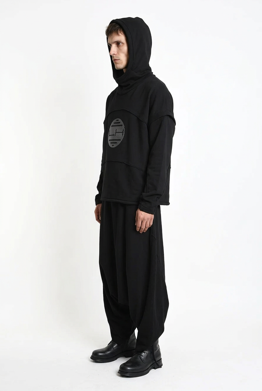LA HAINE INSIDE US M1334 hoodie in black — side view on male model with hood up
