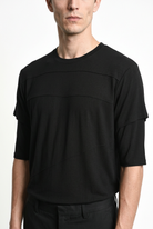 LA HAINE INSIDE US M1358 T-shirt in black — raised chest trim and layered sleeve detail view