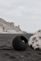 Off, on black sand with pumice