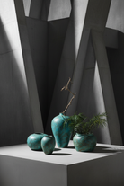 Turquoise vase portrait 1