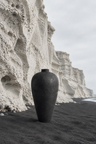 Vlychada pumice cliffs and black sand