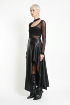 LA HAINE INSIDE US W5418 asymmetric faux leather skirt in black — side-front editorial view