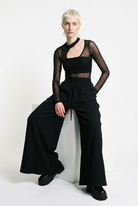 LA HAINE INSIDE US W5451 black embossed fleece palazzo trousers, seated front view