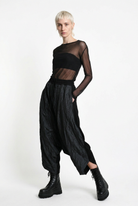 LA HAINE INSIDE US W5488 black baggy drop-crotch trousers, female model, angled standing view