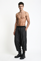 LA HAINE INSIDE US W5488 black baggy drop-crotch trousers, male model, relaxed three-quarter view