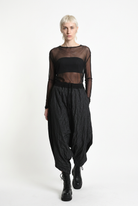 LA HAINE INSIDE US W5488 black baggy drop-crotch trousers, female model, walking front view
