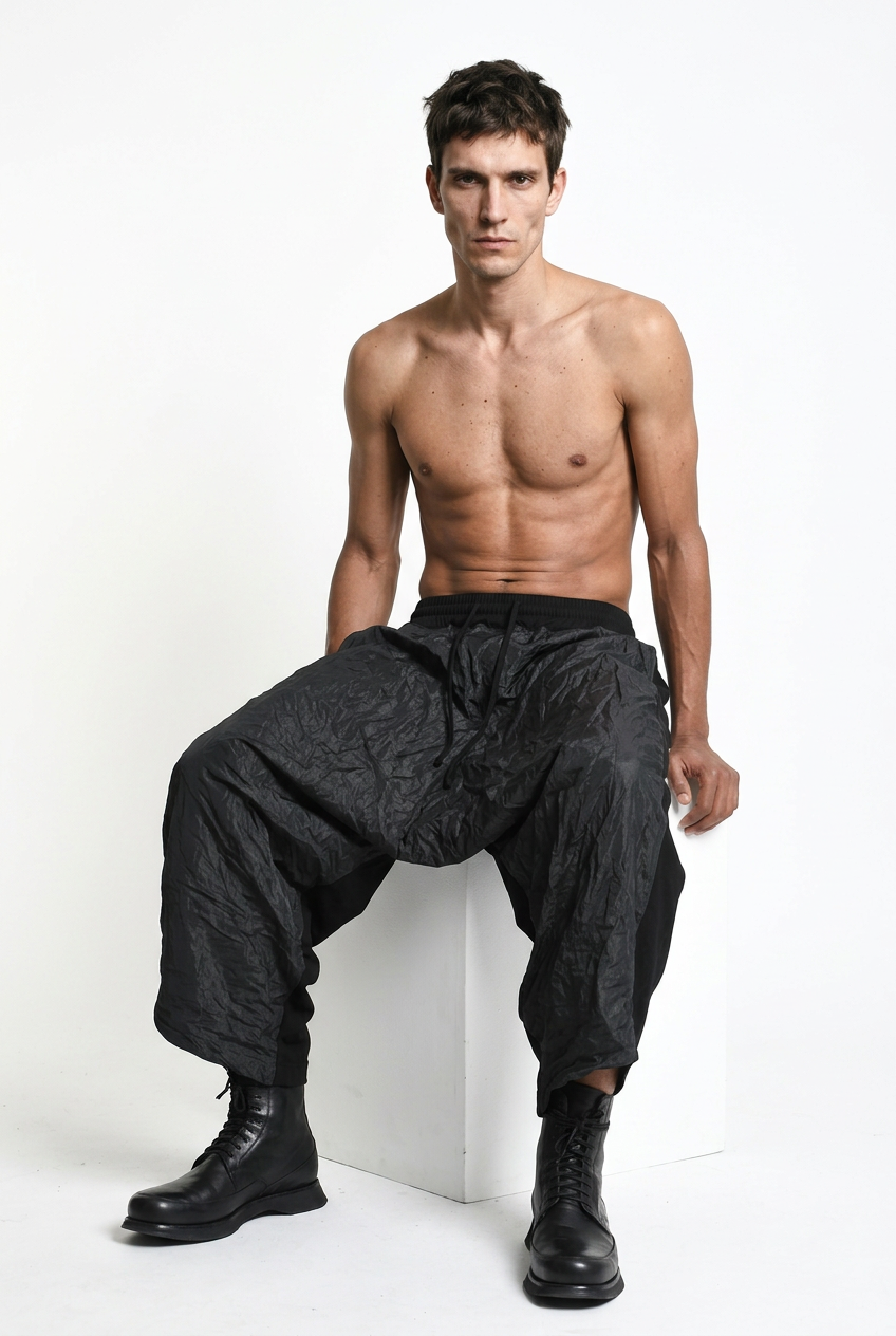 LA HAINE INSIDE US W5488 black baggy drop-crotch trousers, male model, seated view